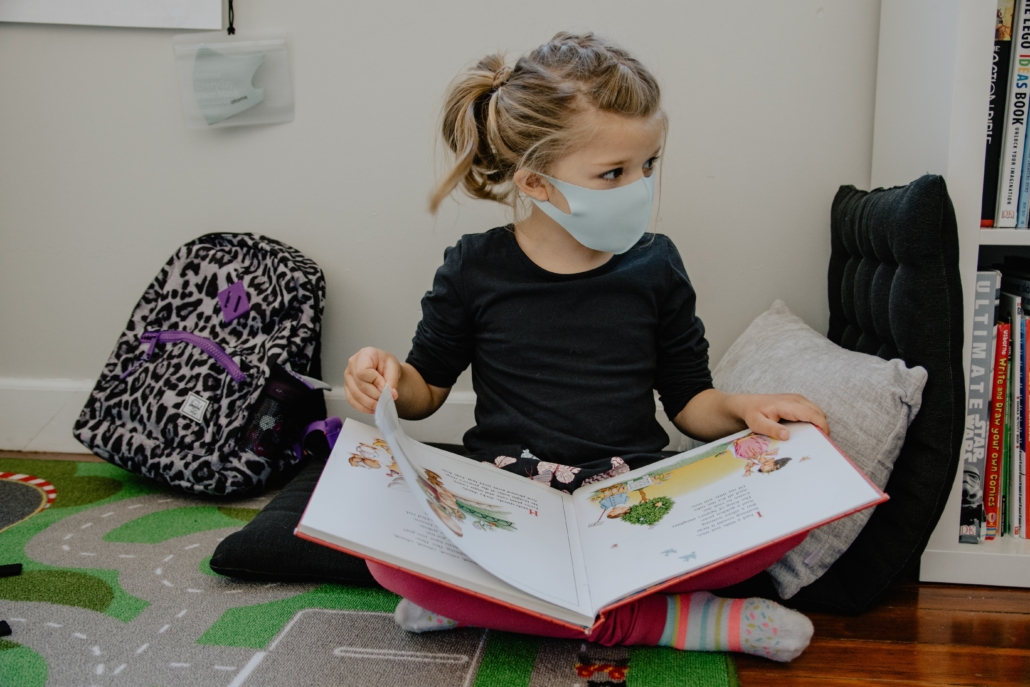 students reading a book in the classroom