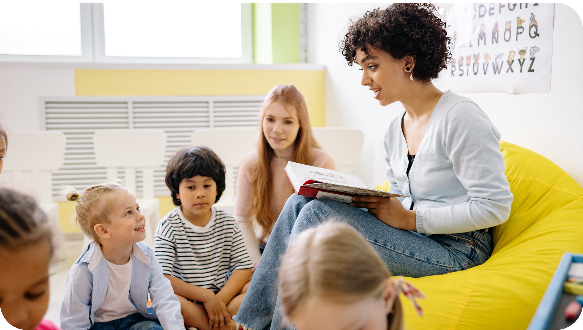 teacher reading to students in the classroom