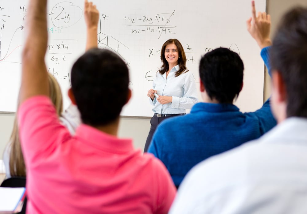 Students in class asking questions to the teacher-1